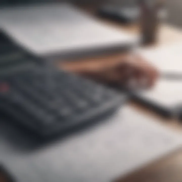 A calculator and financial documents on a desk